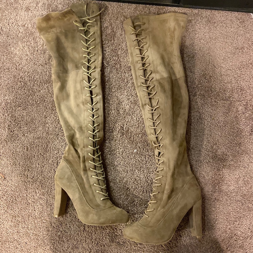 High heeled knee high lace up boots